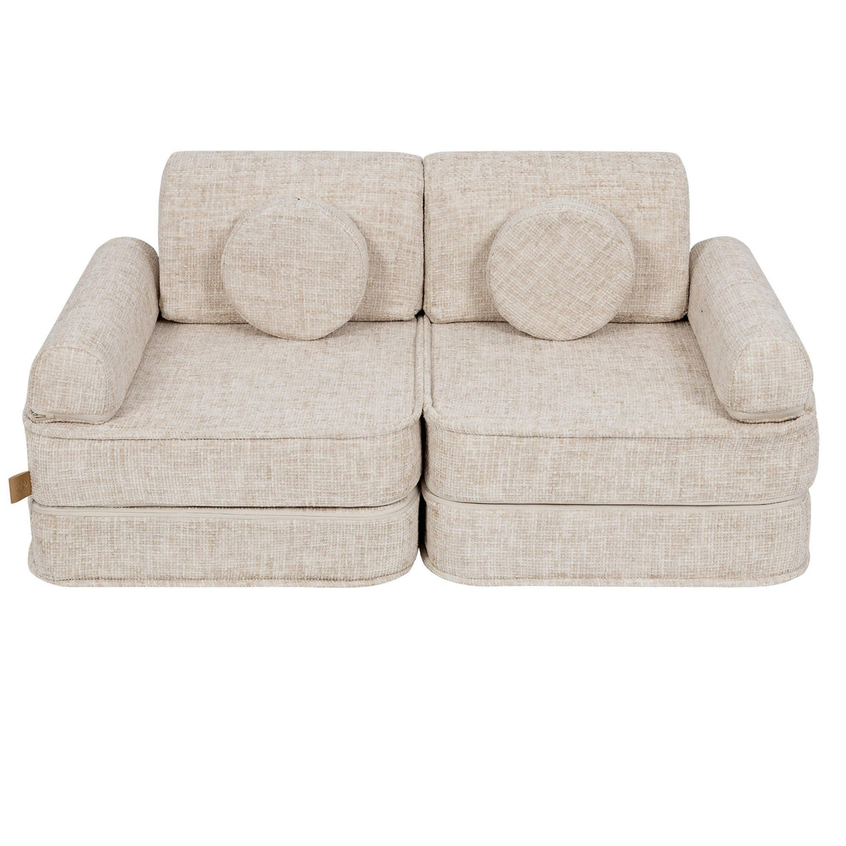 2. Beige modular children's sofa with round cushions, shown in a studio setting
