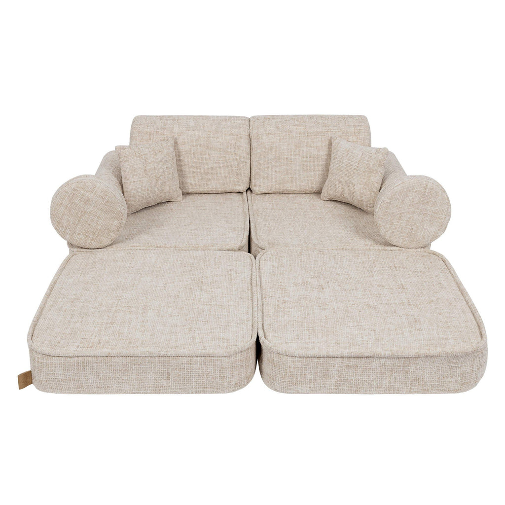 2. Beige modular children's sofa with extended cushions, shown in a studio setting