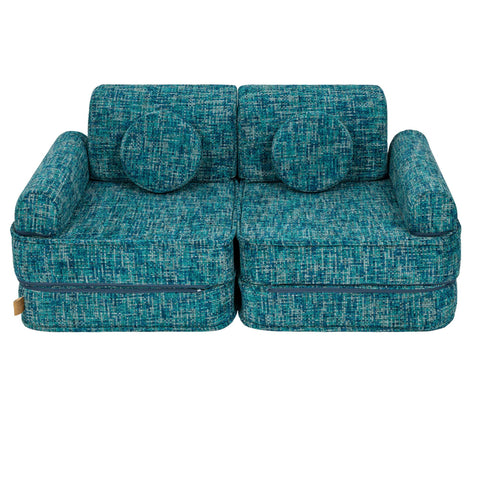 2. Medium modular sofa for kids in tangle lagoon blue with two round cushions, displayed in a studio