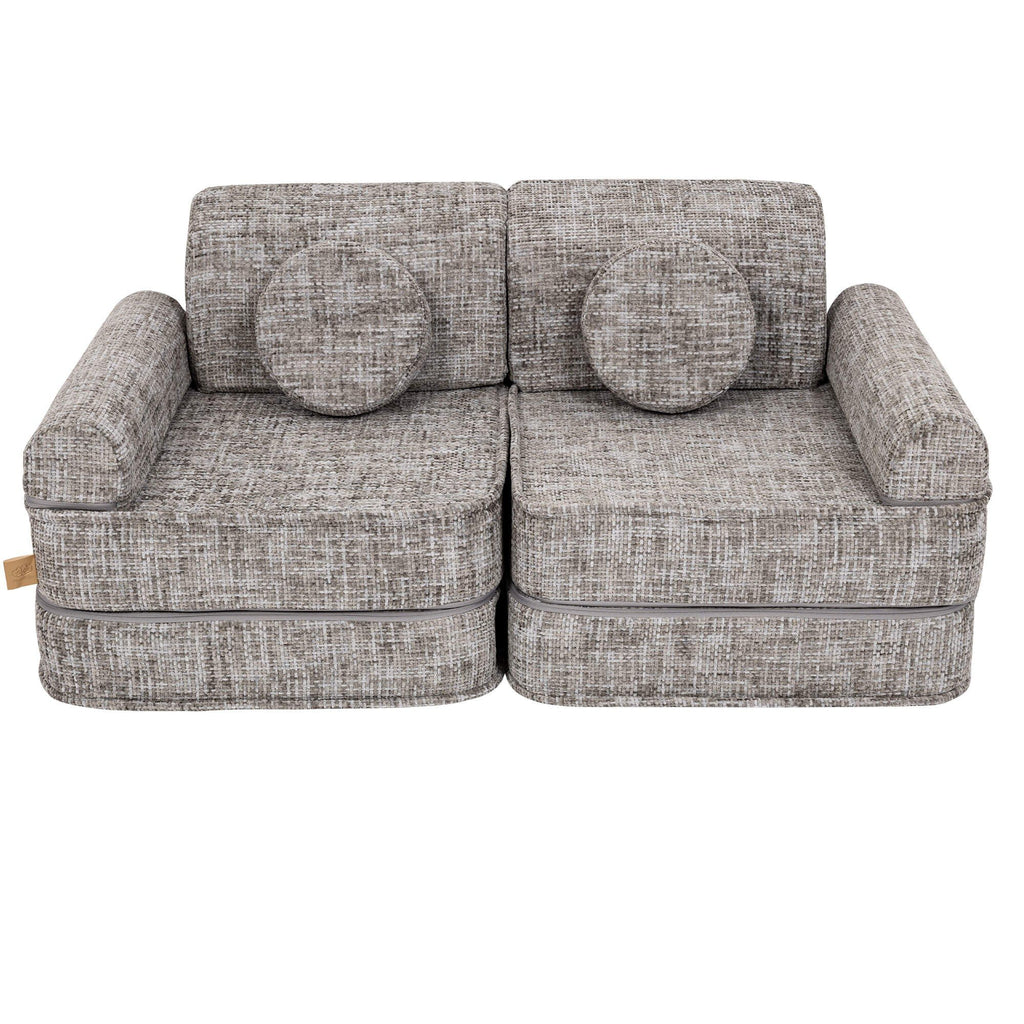 8. Medium modular sofa for kids in tangle moon grey with two round cushions, shown in a studio setting