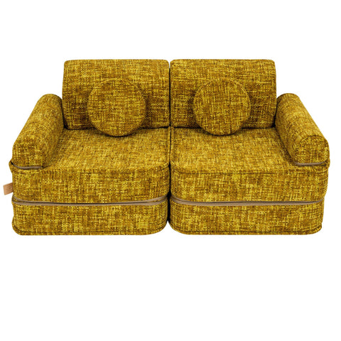 2. Honey mustard modular kids' sofa with two round cushions, displayed in a studio environment.