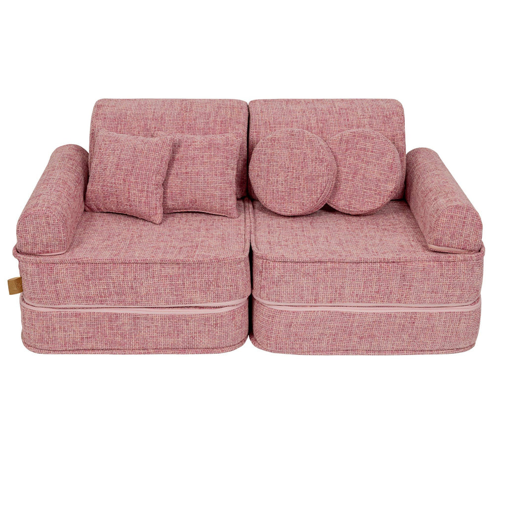 1. Medium modular sofa for kids in bubblegum pink with two round and one square cushion, shown in a studio setting