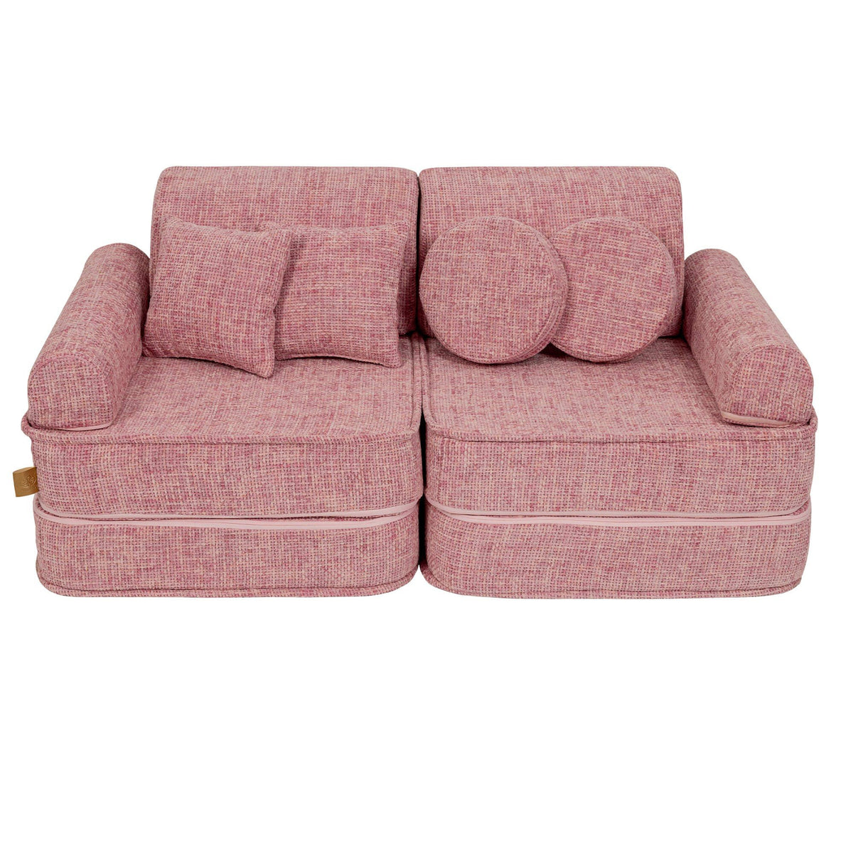 1. Medium modular sofa for kids in bubblegum pink with two round and one square cushion, shown in a studio setting