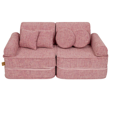 1. Medium modular sofa for kids in bubblegum pink with two round and one square cushion, shown in a studio setting