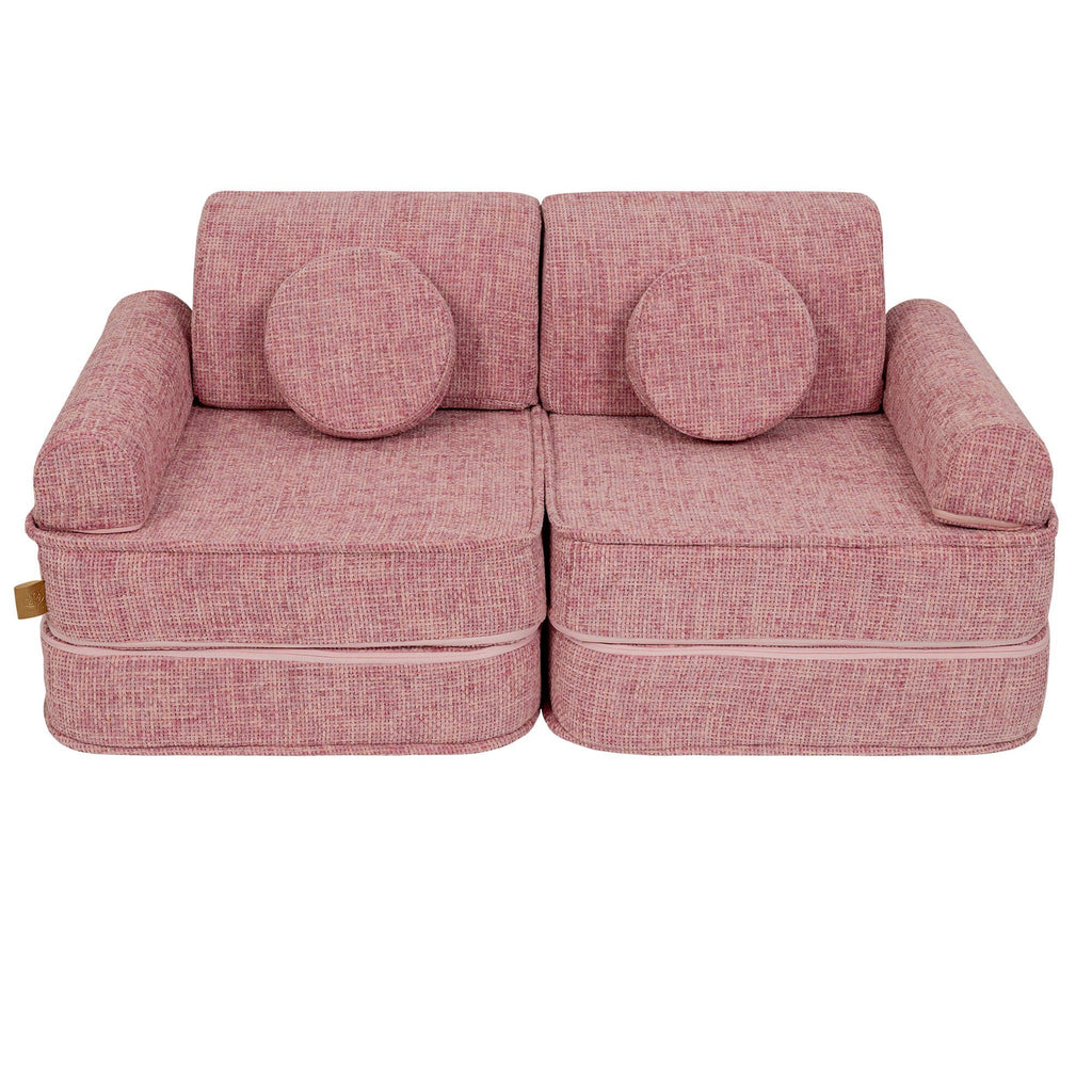 6. Medium modular sofa for kids in bubblegum pink with two round cushions, shown in a studio setting