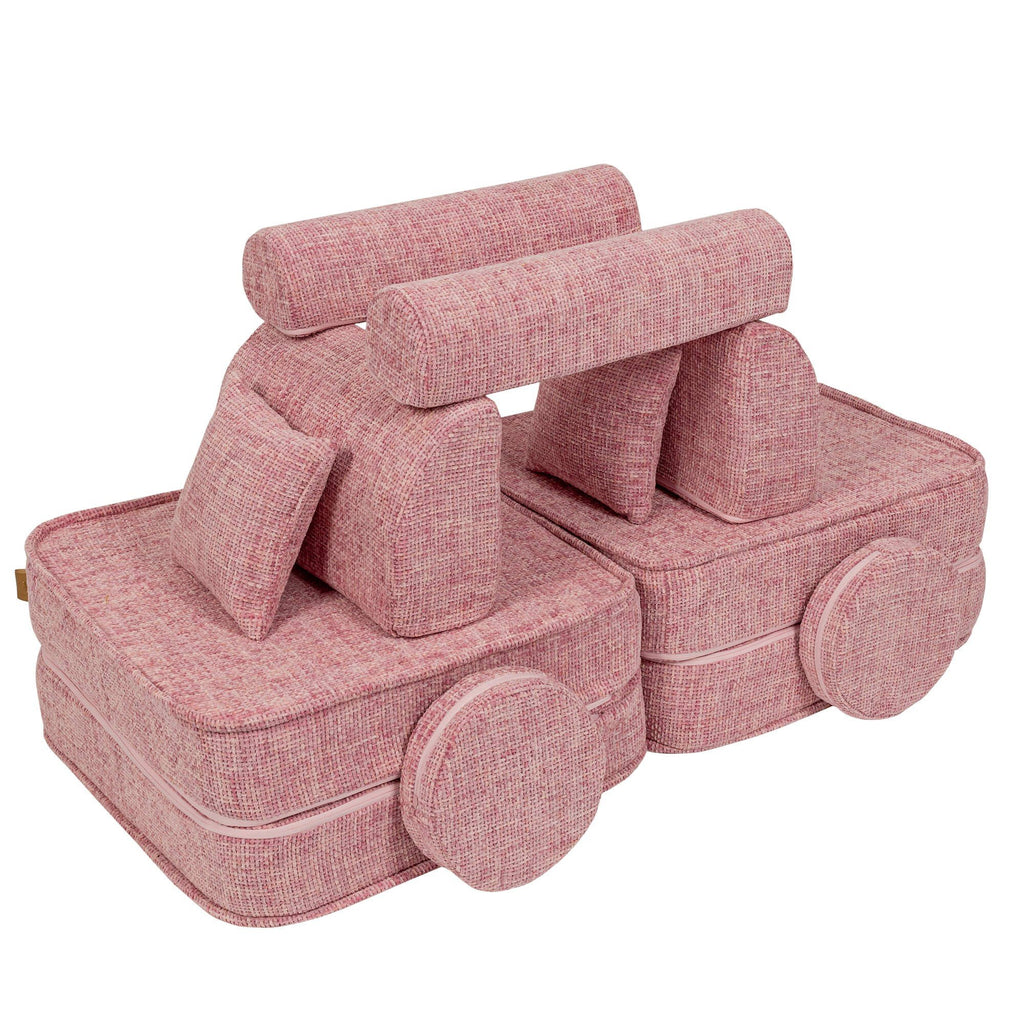 3. Medium modular sofa for kids in bubblegum pink, creatively arranged into a vehicle shape with cushions