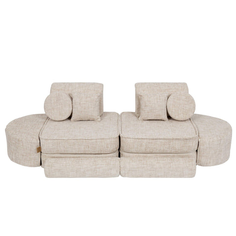 2. Beige modular children's sofa with round cushions, arranged symmetrically, on a white background