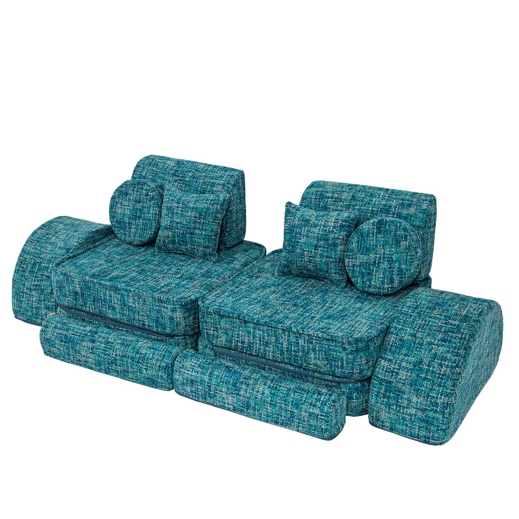 4. Lagoon blue modular sofa with cushions and ottomans arranged in a symmetrical layout