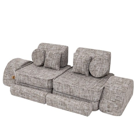2. Grey modular children's sofa with multiple cushions and armrests in a staggered arrangement on a white background