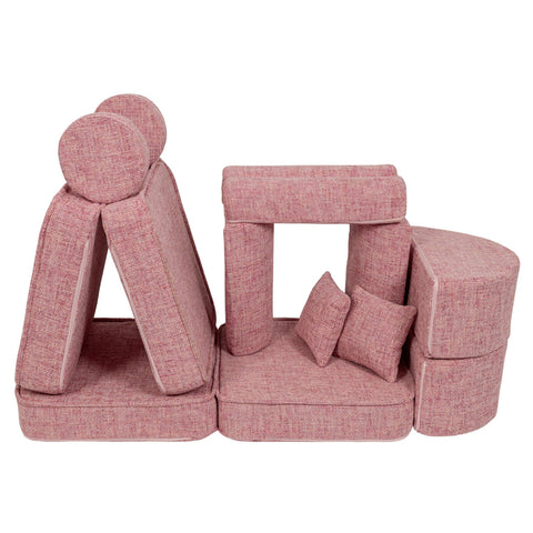 3. Pink modular children's sofa arranged in a creative structure with cushions, showcasing versatility on a white background