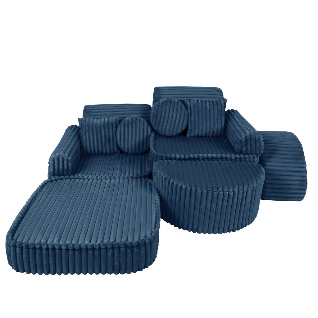 11. Medium modular kids sofa in churros blue with ribbed corduroy fabric, displayed in a relaxed, extended configuration with cushions.