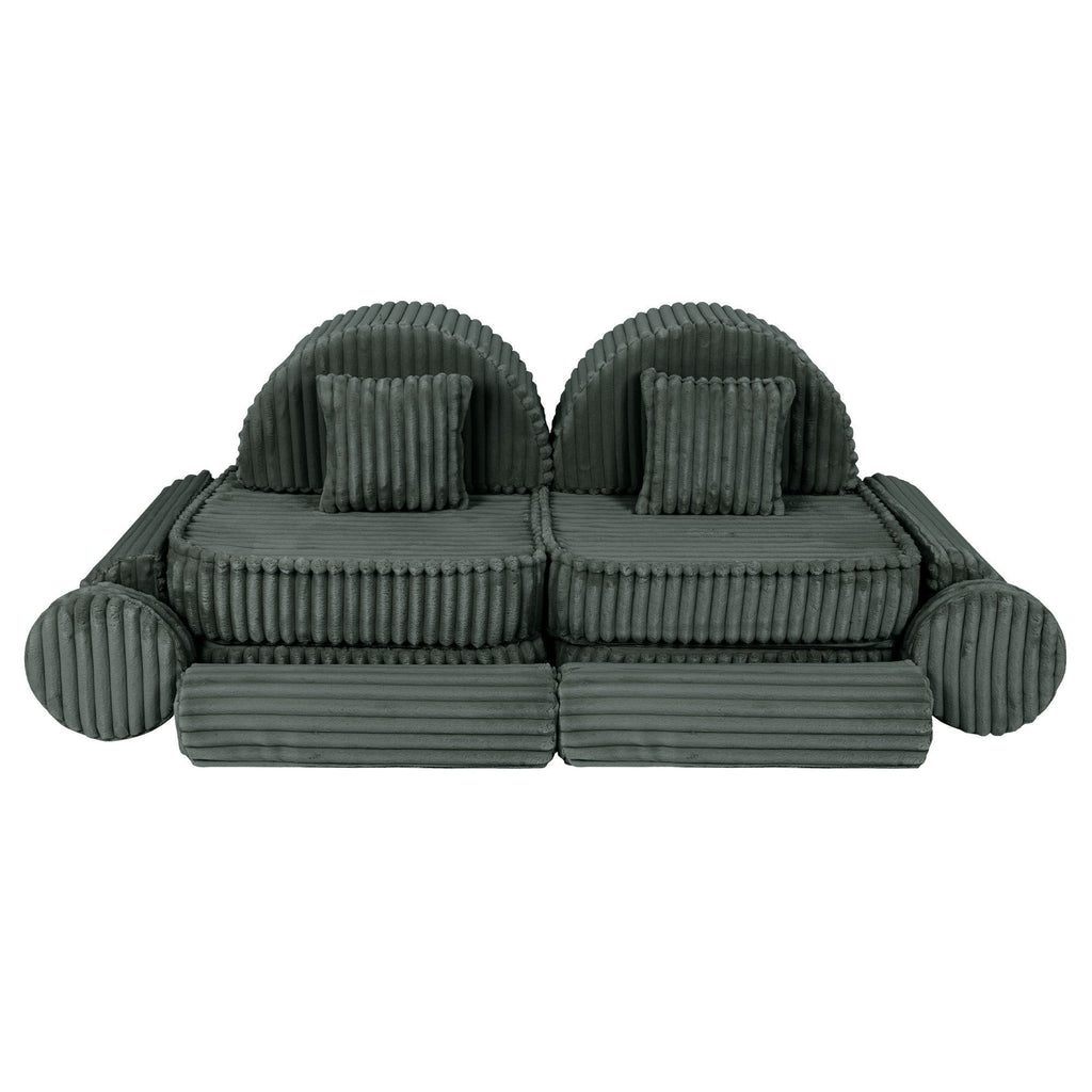 13. Medium modular kids sofa in forest green corduroy with ribbed texture, featuring two round back cushions and two square pillows, arranged symmetrically.