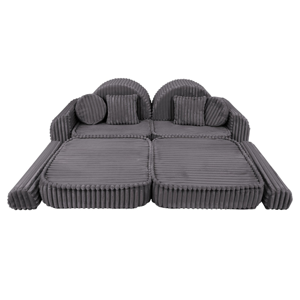 7. Grey ribbed kids sofa with modular design, shown with extended seating and round pillows