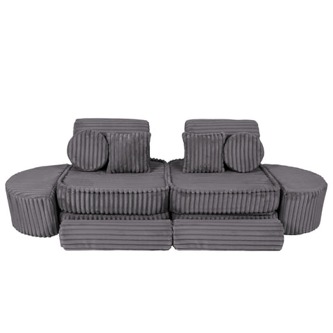 2. Grey modular kids sofa with ribbed texture, featuring two back cushions and round pillows, arranged in a linear layout