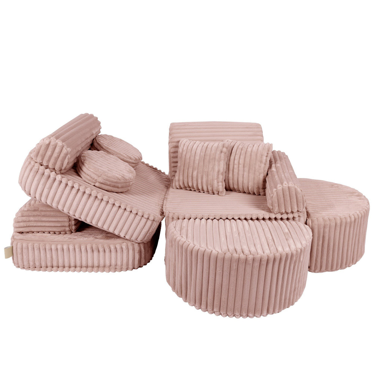 4. Medium modular kids sofa in churros pink with ribbed corduroy fabric, shown in a playful, disassembled layout with cushions scattered.