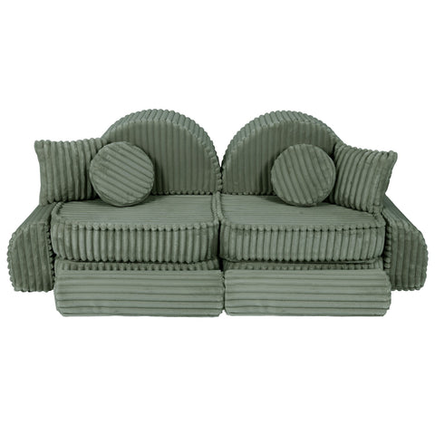 2. Medium modular kids sofa in sage green corduroy with ribbed texture, featuring two seats and circular cushions, arranged in a playful design.