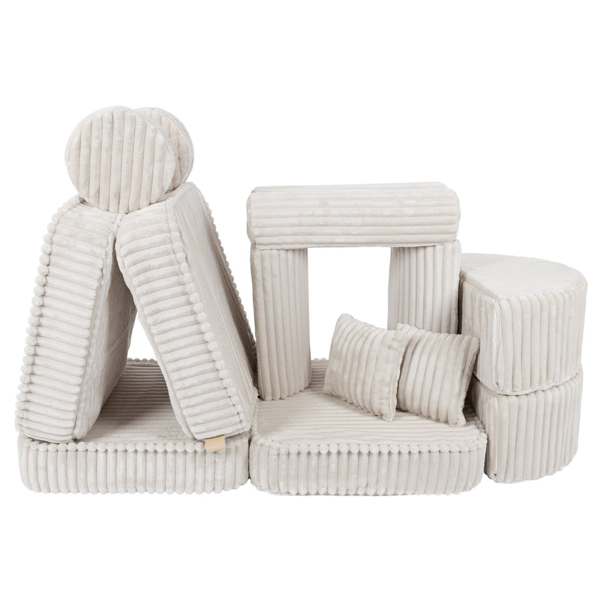 11. Medium kids sofa in churros white with ribbed corduroy fabric, featuring multiple cushions, arranged in a creative play structure.