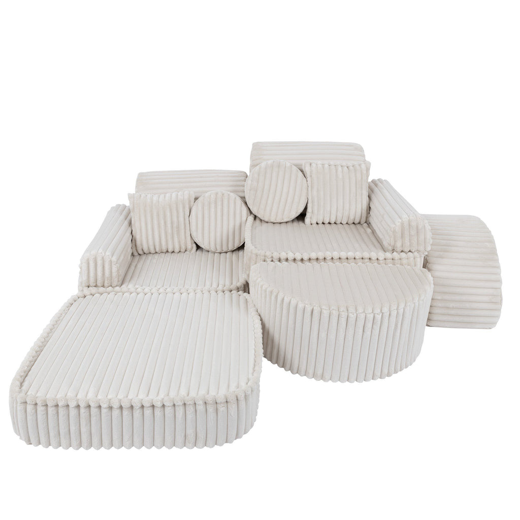 9. Medium kids sofa in churros white with ribbed corduroy fabric, featuring two seats and multiple cushions, arranged in a staggered layout.