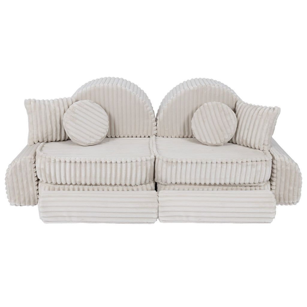 3. Medium kids sofa in churros white with ribbed corduroy fabric, featuring two seats and round cushions, arranged in a symmetrical layout.