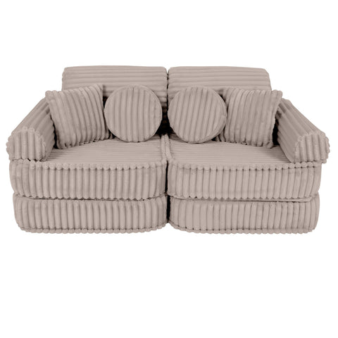 1. Beige modular kids sofa with ribbed corduroy texture and round cushions, shown in a compact configuration