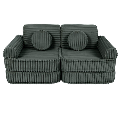 2. Medium modular kids sofa in forest green with ribbed corduroy texture, featuring two round cushions, shown in a compact setup.