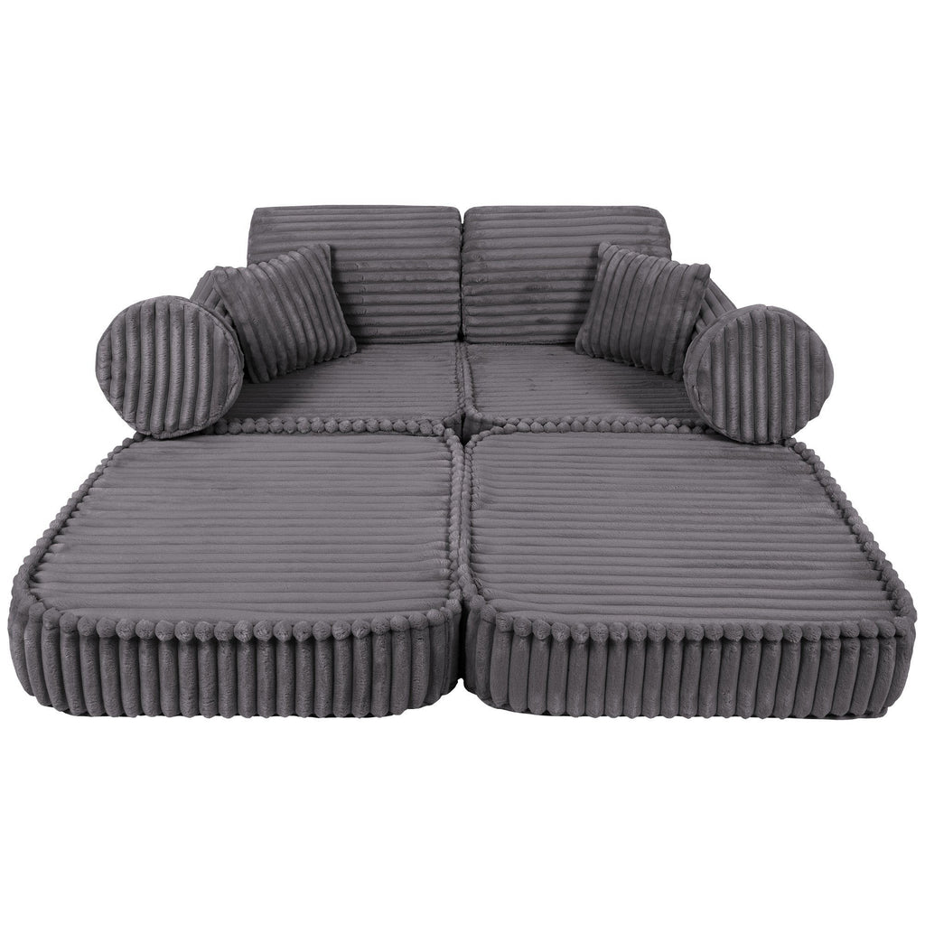 2. Medium modular kids sofa in Jurassic grey, fully extended with ribbed corduroy texture and round cushions.