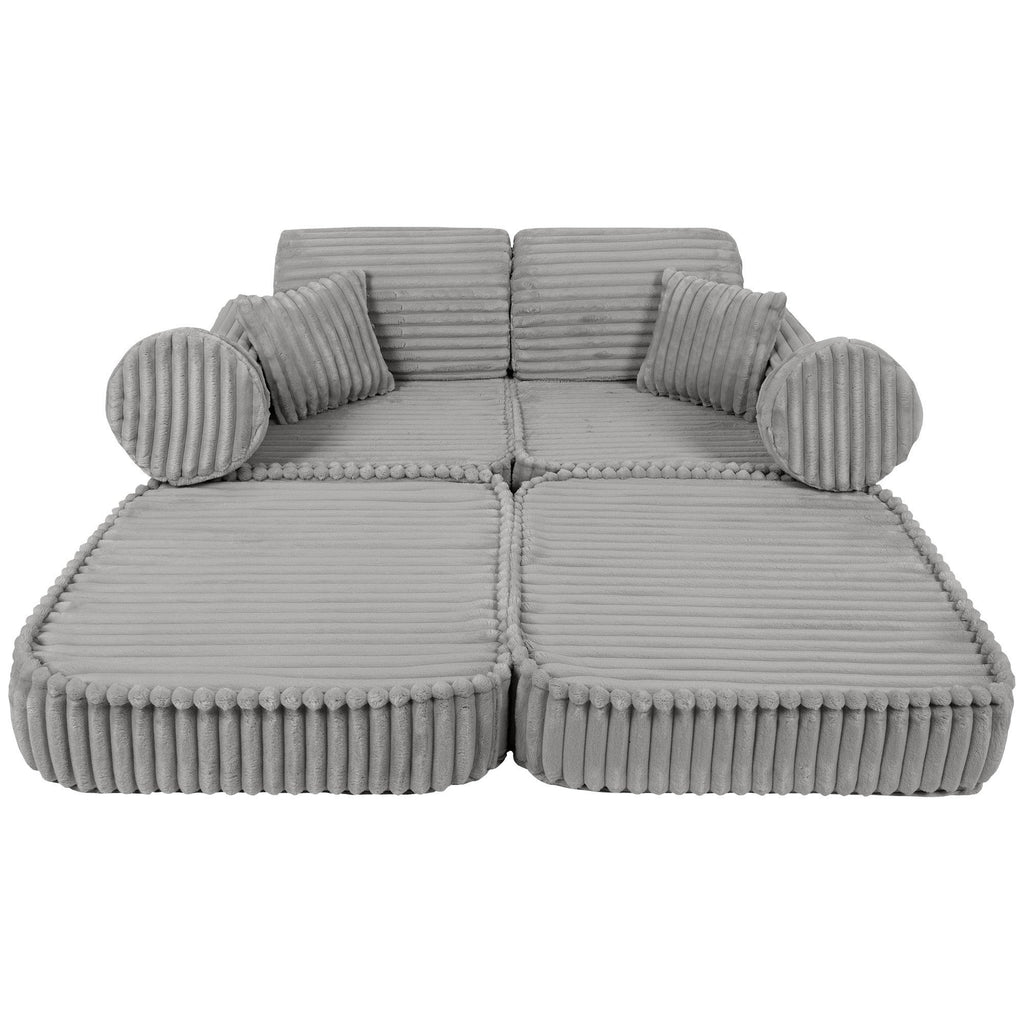 5. Medium modular kids sofa in moon grey with ribbed corduroy texture, laid flat with round and square cushions for lounging