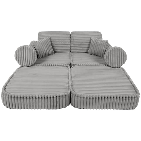 5. Medium modular kids sofa in moon grey with ribbed corduroy texture, laid flat with round and square cushions for lounging