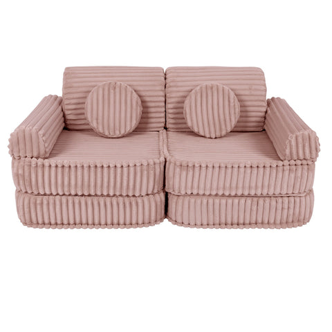 4. Medium modular kids sofa in churros pink with ribbed corduroy texture, featuring two round cushions, shown in a compact configuration