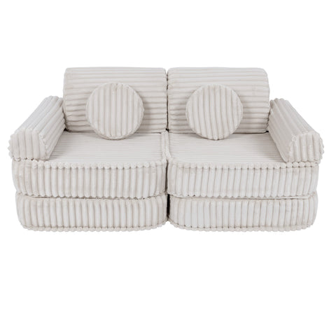 2. Medium kids sofa in churros white with ribbed corduroy fabric, featuring two round cushions, shown in a compact configuration.