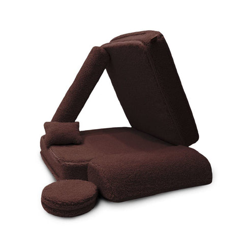 2. Dark brown modular children's chair with elements rearranged to form a tent-like structure on a white background