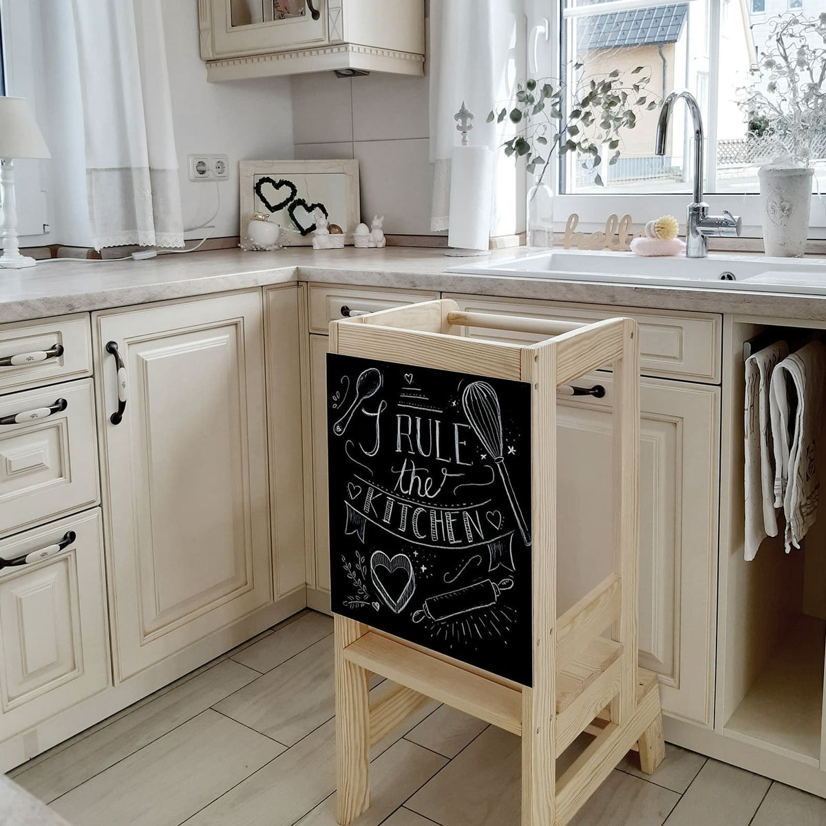 7. Wooden kitchen helper with decorative blackboard in cozy kitchen