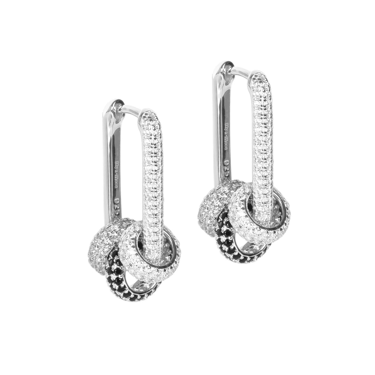 3. Pair of Metropolitan Glow earrings with silver-toned rhodium plating and white zircon charms on a white background