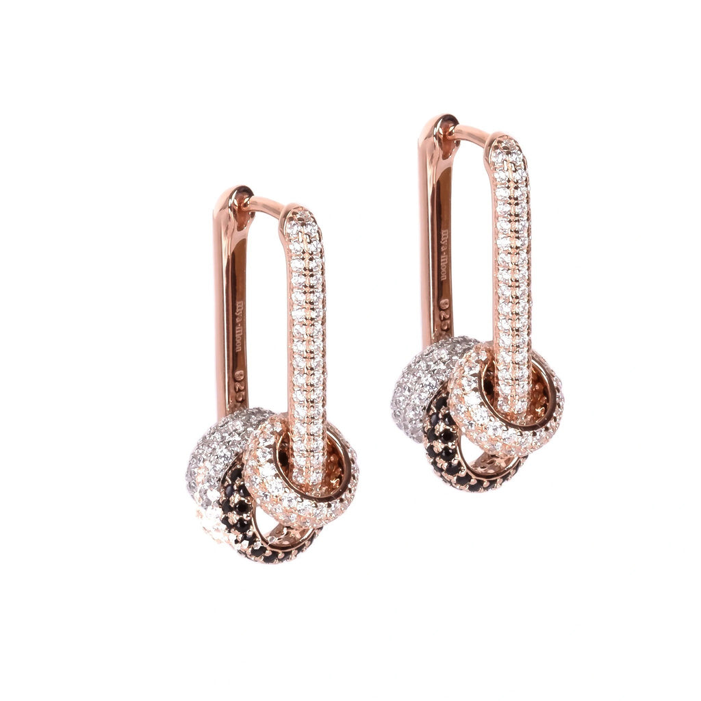 2. Pair of Metropolitan Glow earrings with rose gold plating and white zircon charms on a white background