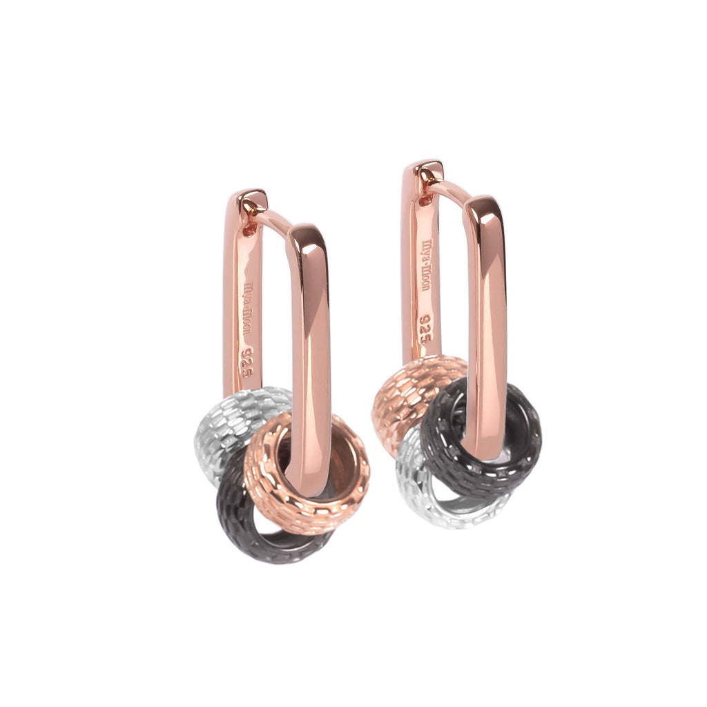 2. Rose gold plated sterling silver hoop earrings with three detachable textured charms in silver, rose gold, and black, shown in studio lighting