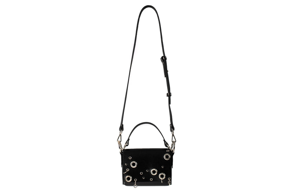 8. Studio image of PYKOK Handbag Mia with long adjustable strap and magnetic closure