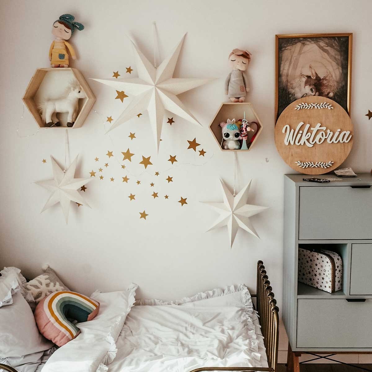 6. Kids' room with gold star wall stickers, decorative stars, and personalized name decor