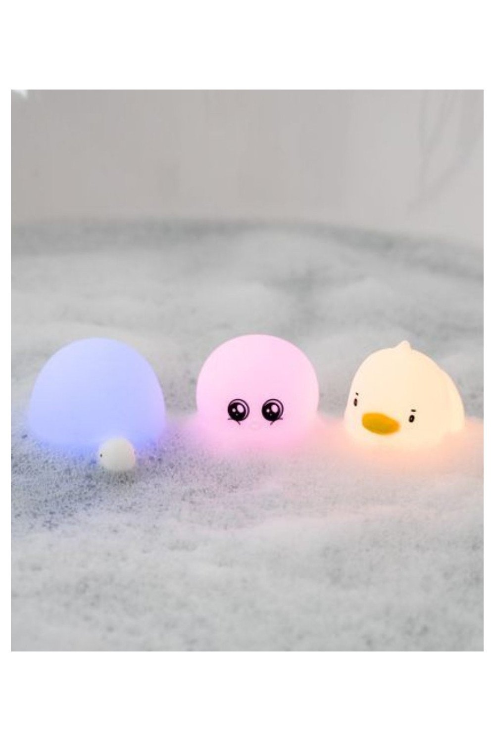 1. Set of three glowing aquatic silicone lamps in duck, octopus, and turtle shapes floating in a bubble bath