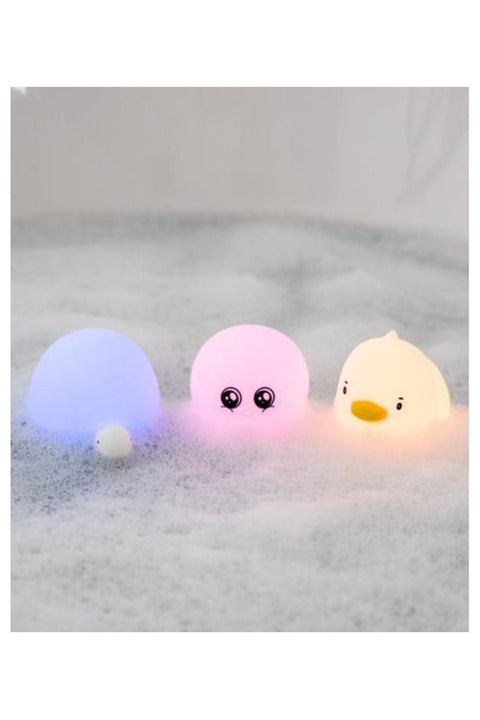 1. Set of three glowing aquatic silicone lamps in duck, octopus, and turtle shapes floating in a bubble bath
