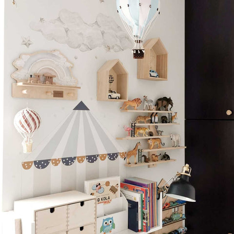 5. Children's room with mini wall shelf featuring blue rainbow design, surrounded by wooden shelves and hot air balloon decor