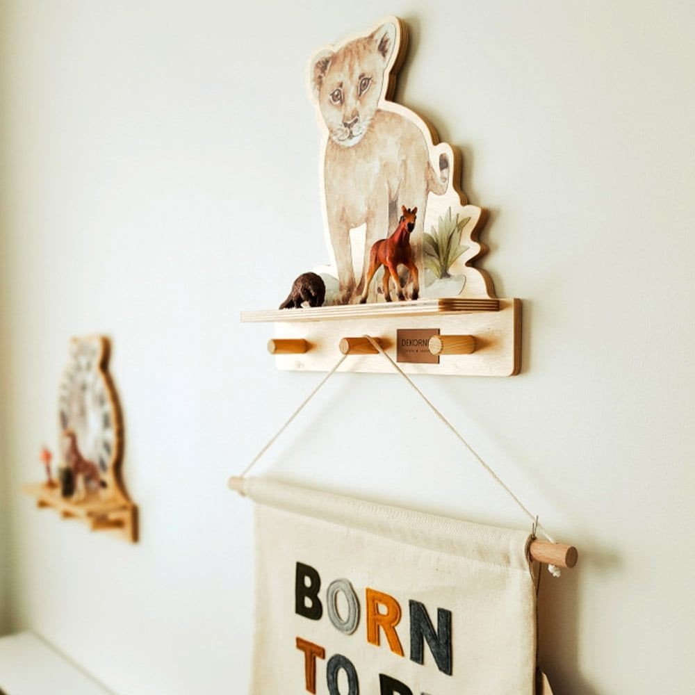 1. Dekornik mini wall shelf with lion design in a child's room, displaying small toys and a hanging banner