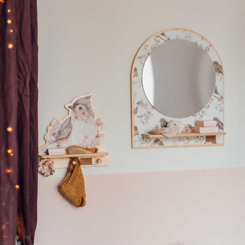 1. Mini wall shelf with bird design mounted next to a mirror in a cozy room setting, holding a small bag and accessories