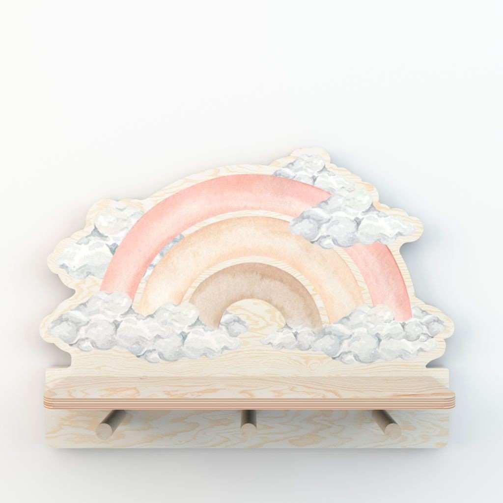 2. Studio shot of Dekornik mini wall shelf with pink rainbow and cloud design, featuring three wooden pegs, on a white background