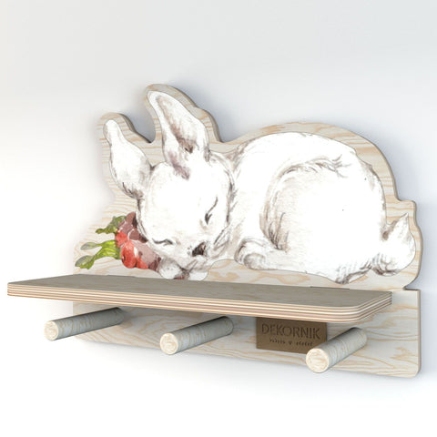 3. Dekornik mini wall shelf with rabbit motif, showcasing the shelf depth and peg length, made from bright plywood, ideal for organizing, in a studio setting