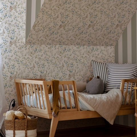 4. Cozy toddler room with wooden bed and beige wallpaper featuring ducks and bunnies