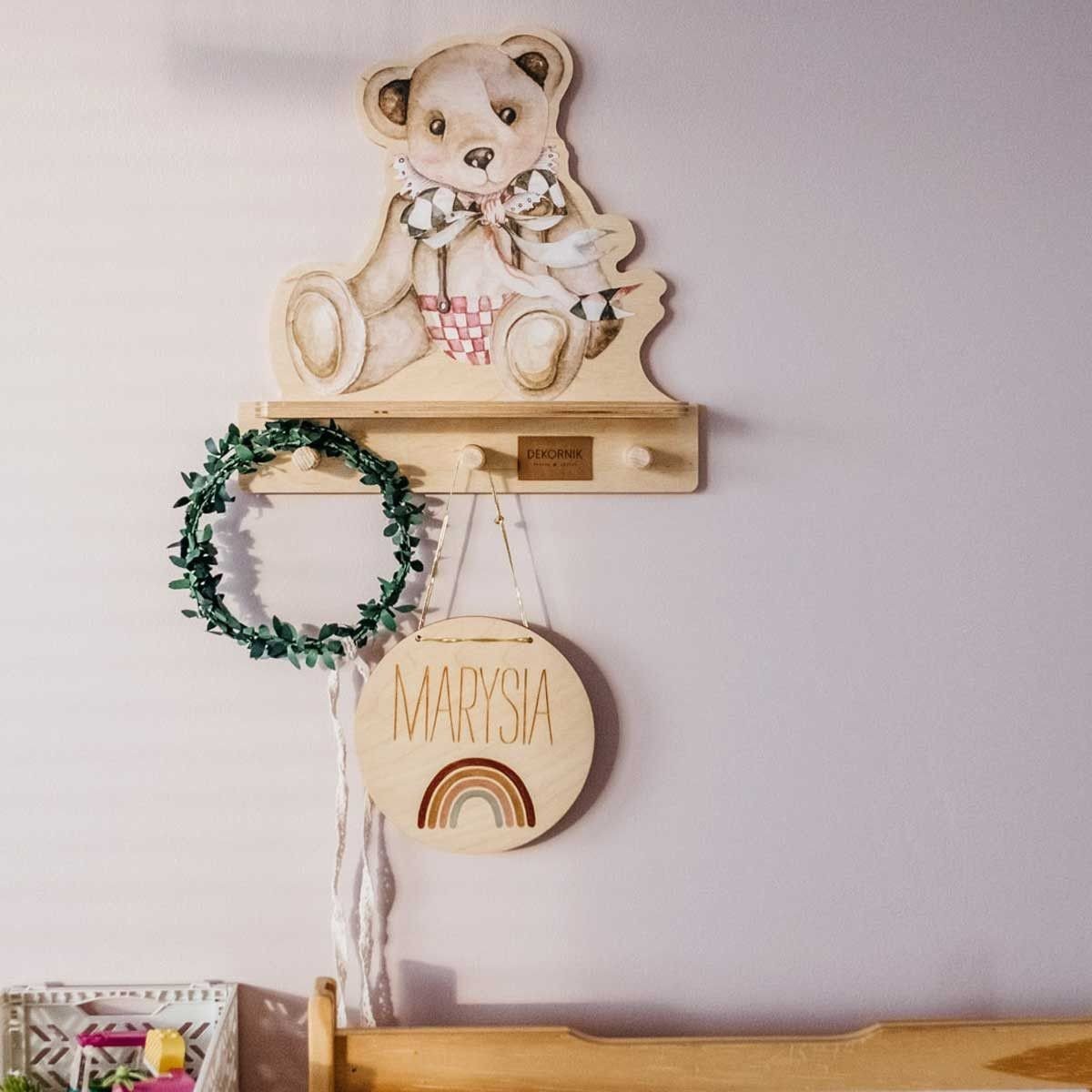 1. Dekornik mini wall shelf with teddy bear design mounted on wall, holding decorative items in a child's room