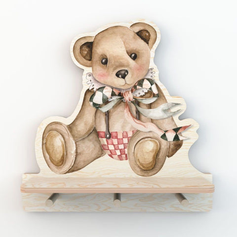 2. Studio shot of Dekornik mini wall shelf with teddy bear design, featuring three pegs and a colorful printed sticker on plywood