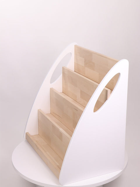 3. Front view of empty Montessori bookshelf with four natural wood shelves and white sides