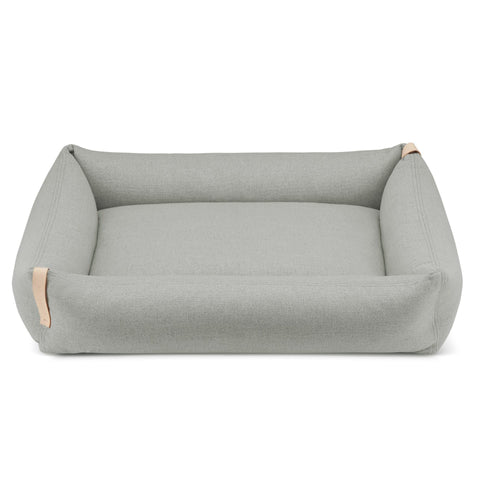 2. Grey Moe dog bed by Labbvenn with a minimalist design, featuring a rectangular shape and natural leather accents, shown on a white background.