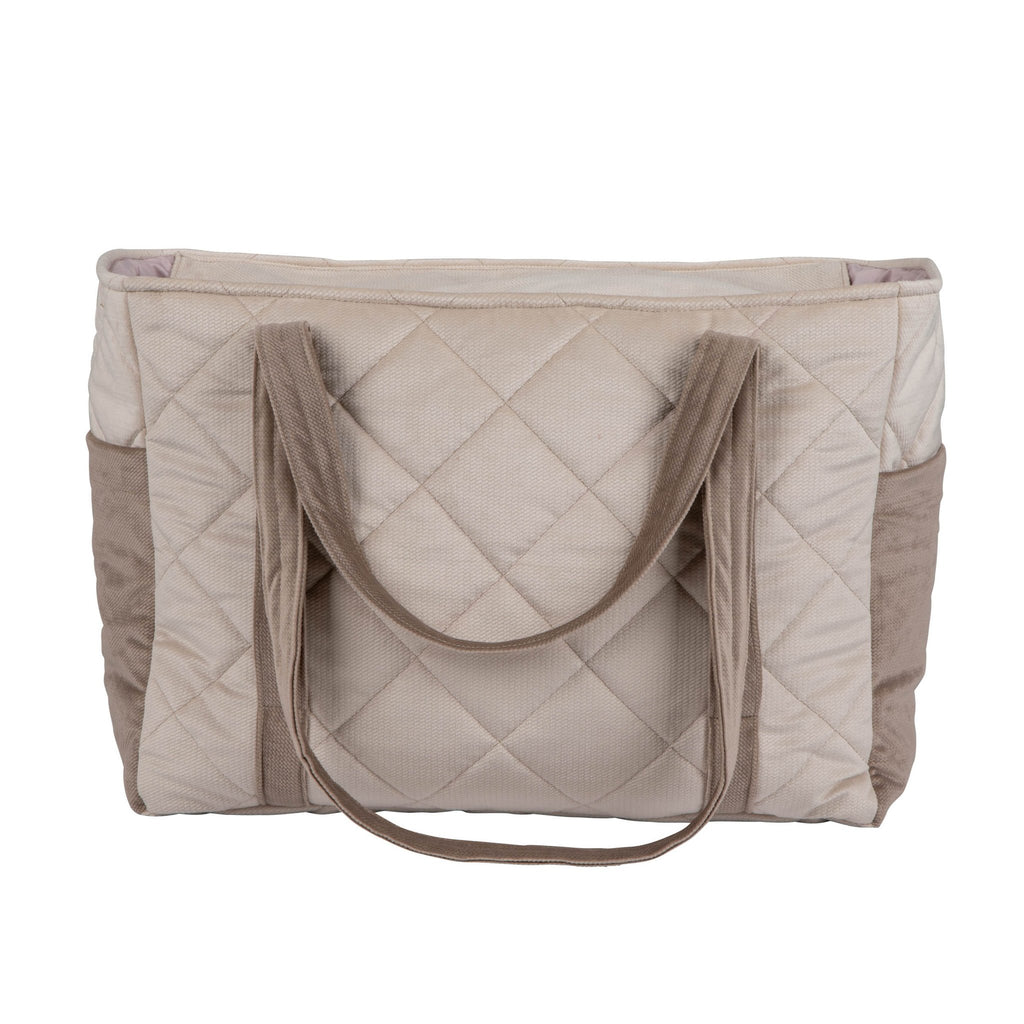 2. Back view of beige mom weekender bag with quilted design and long straps in studio setting